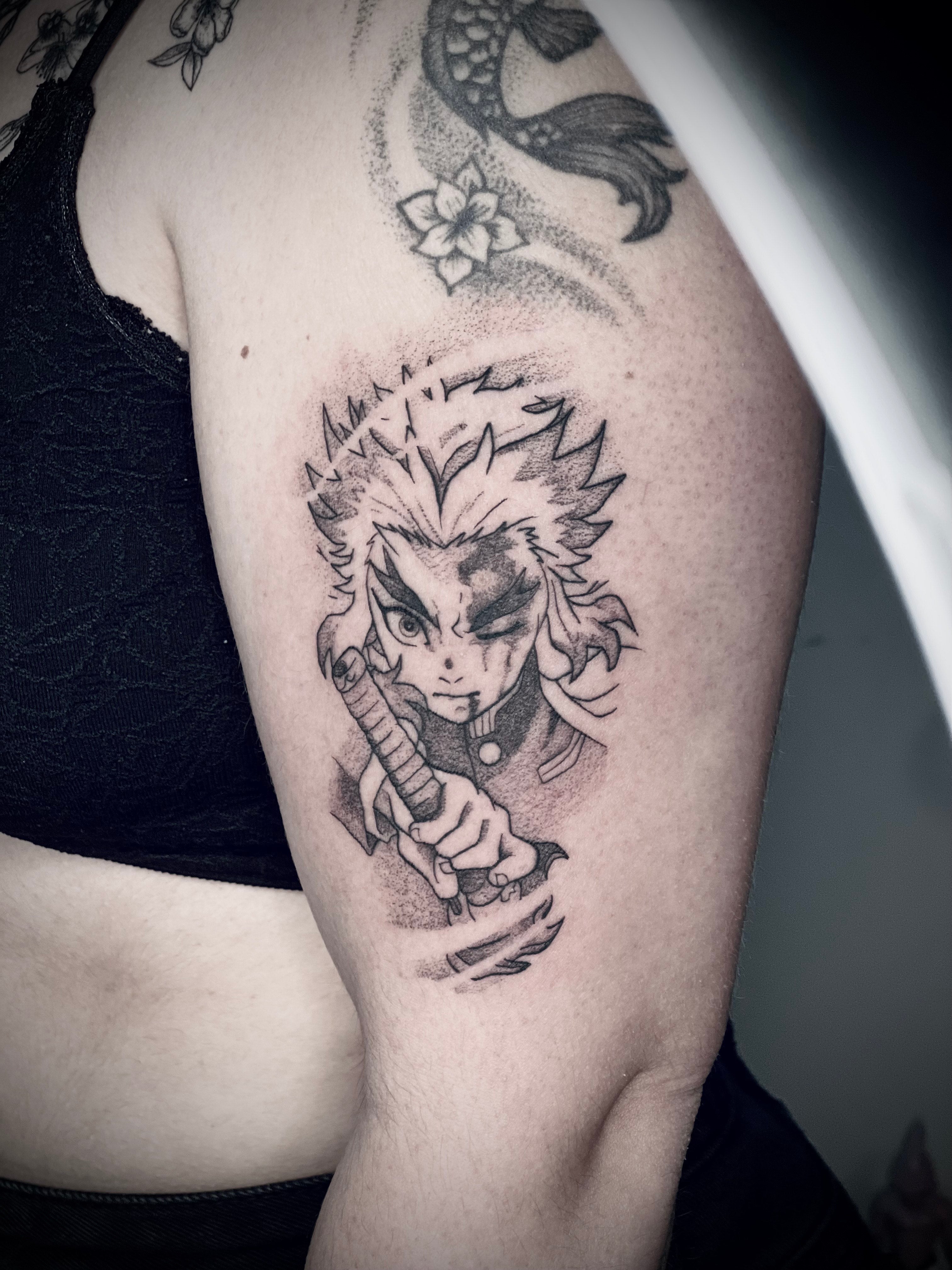 tatouage manga rengoku demon slayer.jpeg